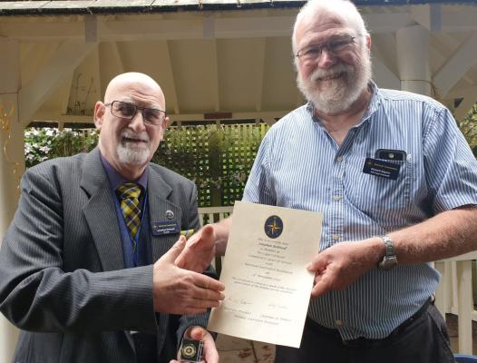 NCI Trustee Jonathan Rothwell from NCI Cape Cornwall receiving 10 year badge from Richard Saynor, Station Manager at NCI Cape Cornwall