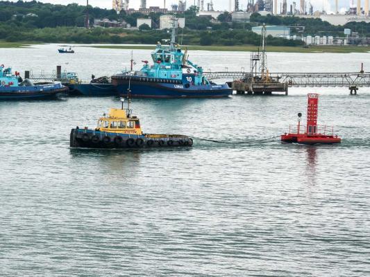 New Calshot Spit light float is towed out 