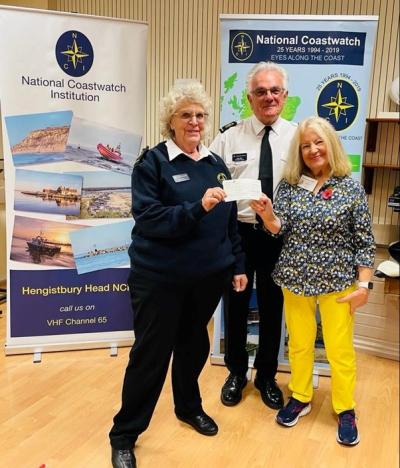 NCI Hengistbury Head presentation team receiving a donation from the New Hilton Community Centre