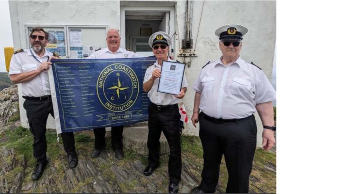The NCI 30th Anniversary flag is delivered to NCI Boscastle by NCI Minehead