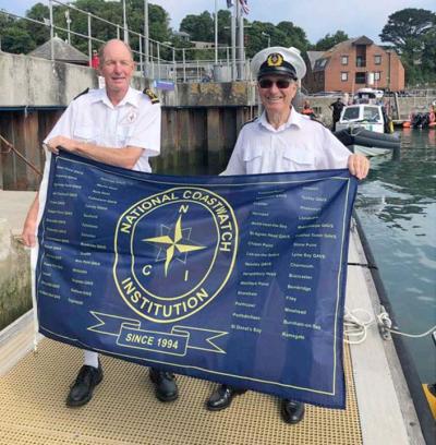 The flag is handed over to the NCI Stepper Point Station Manager