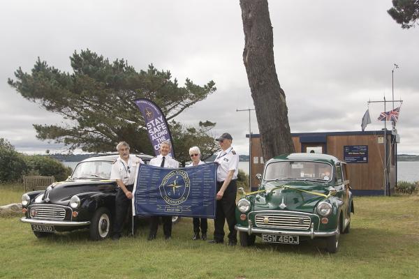 NCI 30th Anniversary Flag departs in two Morris Minors