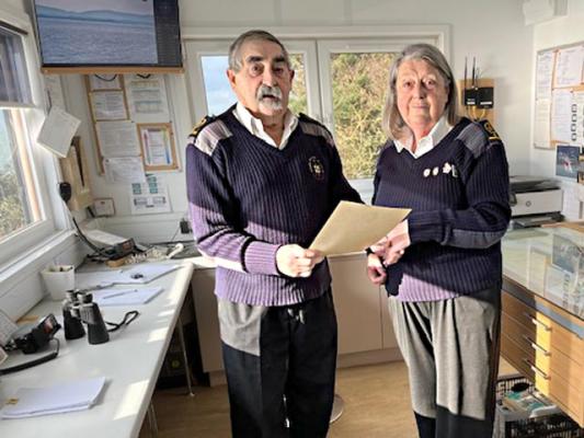 Previous Station Manager Diana R. receives her 15 year Long Service Certificate from the present SM