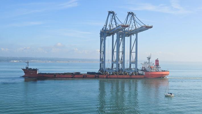 Derricks for the Container Port pass Calshot Tower