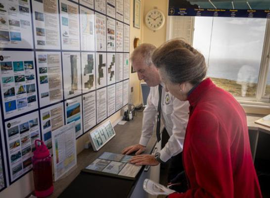 HRH The Princess Royal looking at Photos of Station improvement works