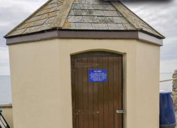 The station entrance with the door plaque