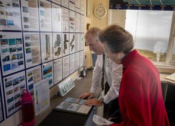 HRH The Princess Royal looking at Photos of Station improvement works